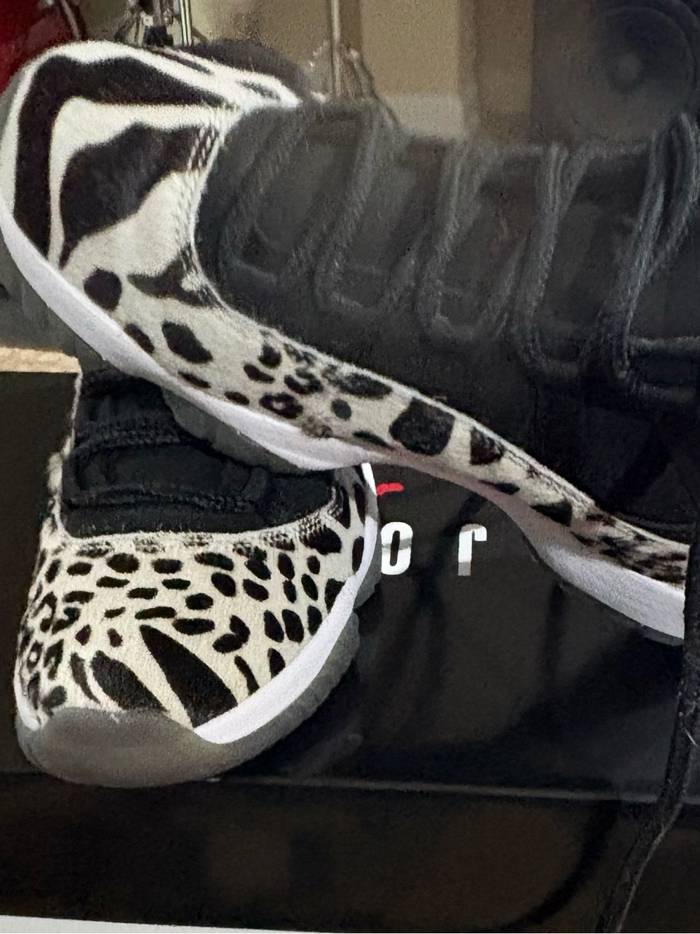 Jordan’s Women Black & White Animal Print Sneakers